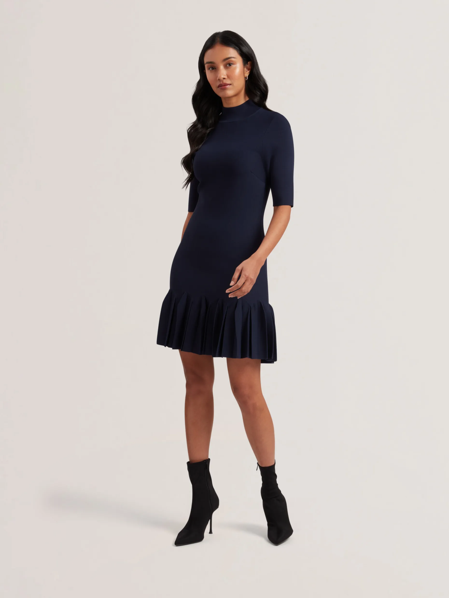canddy_pleated_hem_bodyco_0-1.webp Canddy Pleated Hem Bodycon Knit Mini Dress
