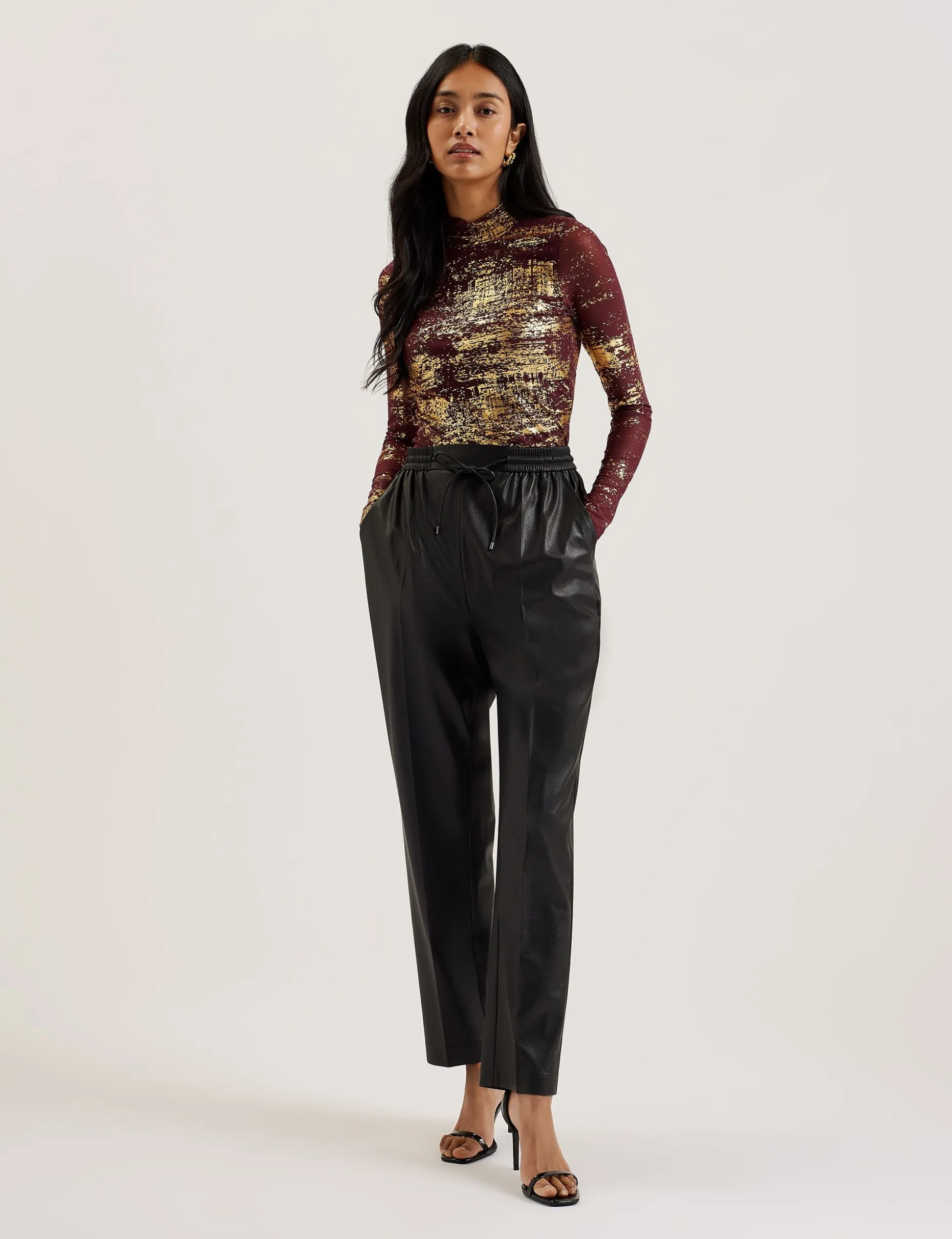 sofiy_foil_print_high_nec_1.webp Sofiy Foil Print High Neck Mesh Top